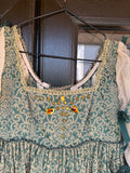 Character period green and gold gown